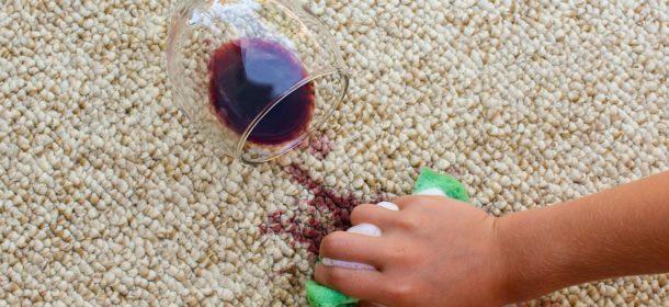 Red wine spilt on carpet being cleaned